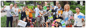 Sustainability - image of people holding up signs promoting sustainability 